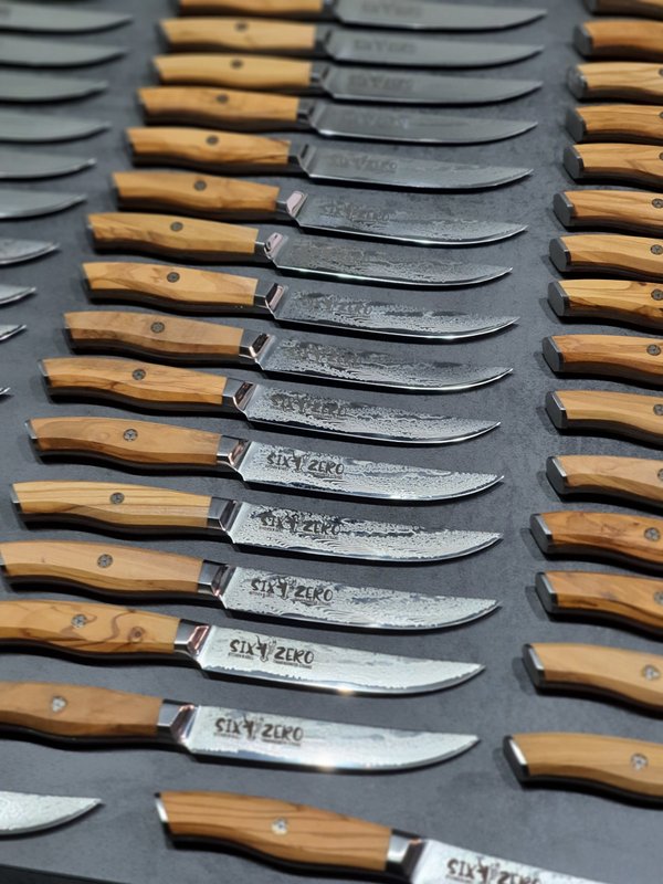 several personally engraved Damask knives by Devil's Hole